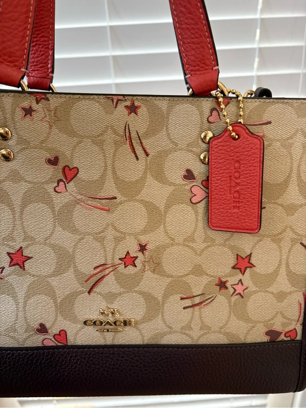 Coach Dempsey 29 Beige Signature Canvas Tote with Red Trim and Charms